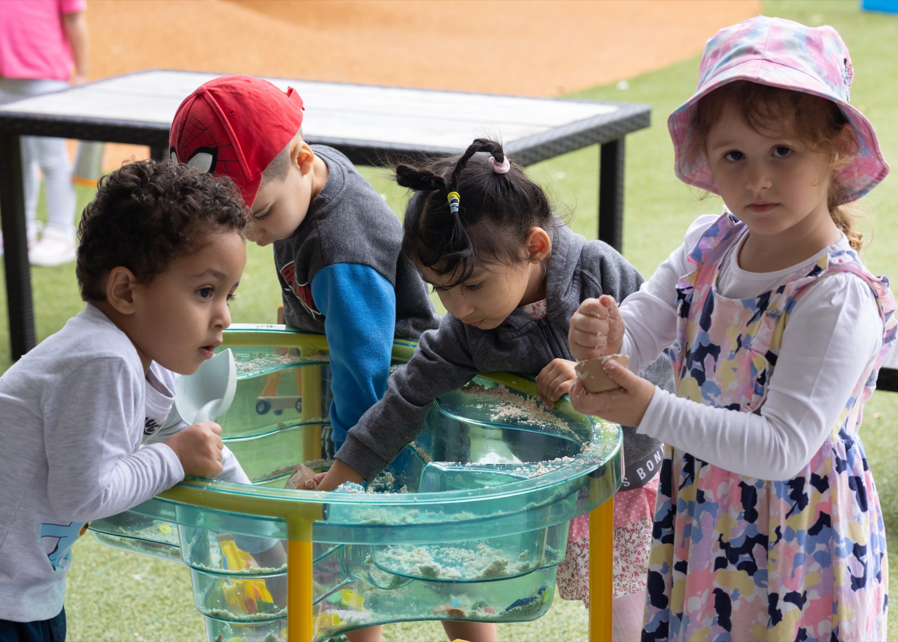 Children playing at a water table